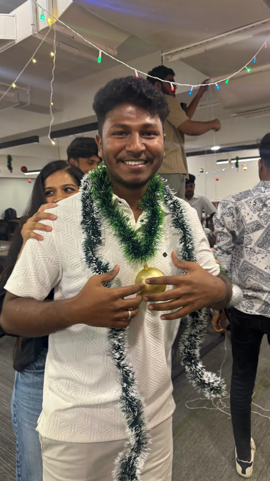 Wearing a tinsel garland at a celebration
